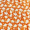 Tissu orange motif petites fleurs avec coeur jaune