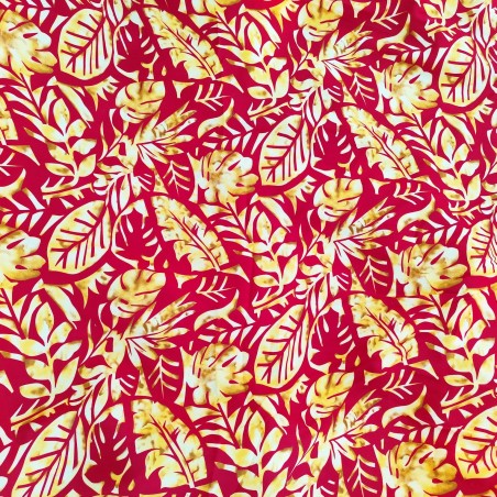Tissu couleur rouge et or motifs feuillage tropical stylisé