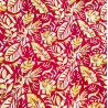 Tissu couleur rouge et or motifs feuillage tropical stylisé