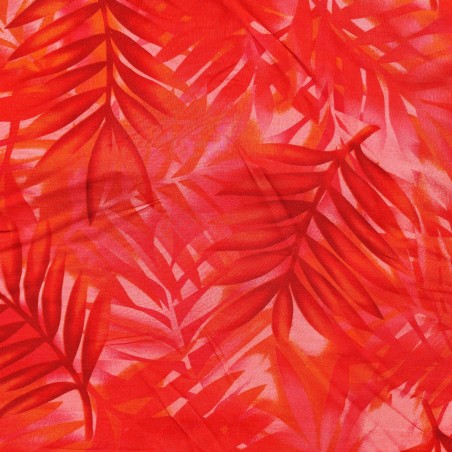 Tissu rouge vif avec motifs feuillage facon pochoir