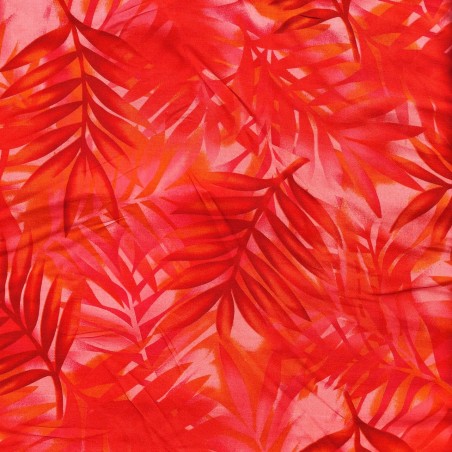Tissu rouge vif avec motifs feuillage facon pochoir