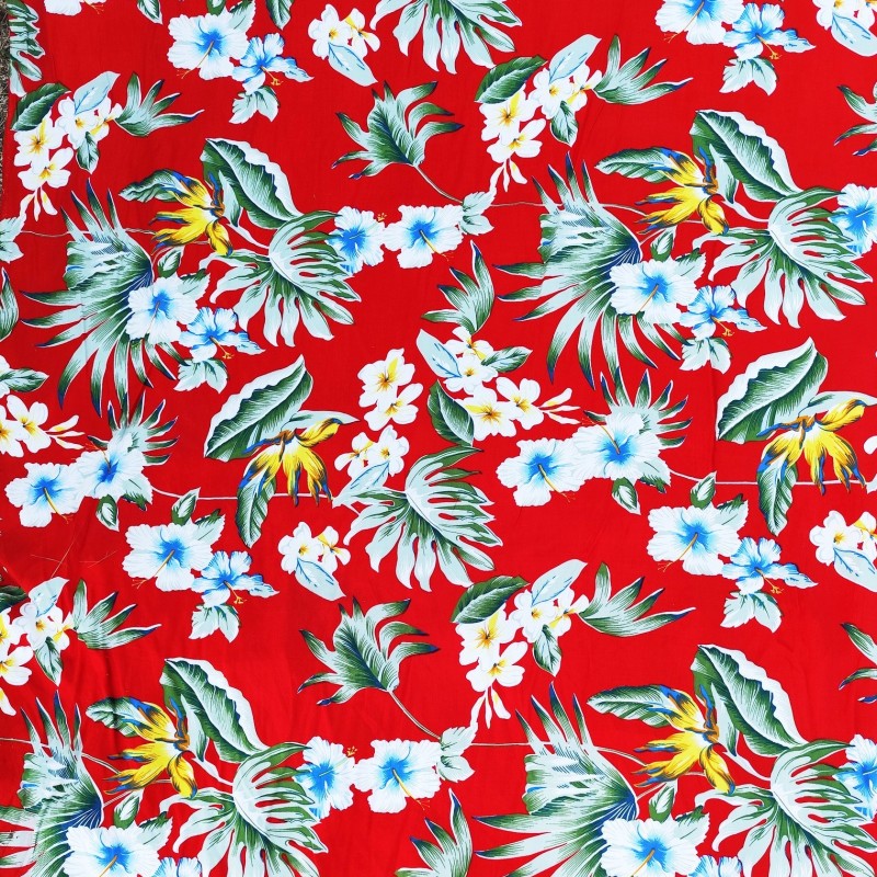 Tissu rouge vif avec motifs feuillage facon pochoir