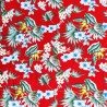 Tissu rouge vif avec motifs feuillage facon pochoir