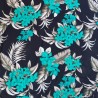 Tissi fleuri fond noir motifs fleurs de frangipane couleurs vert et argent