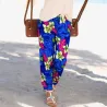 Pantalon de plage bleu motif tatouage et frangipane