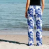 Pantalon de plage rouge aux motifs tropicaux