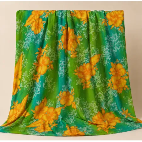 Tissu tropical vert et orange à fleurs hibiscus